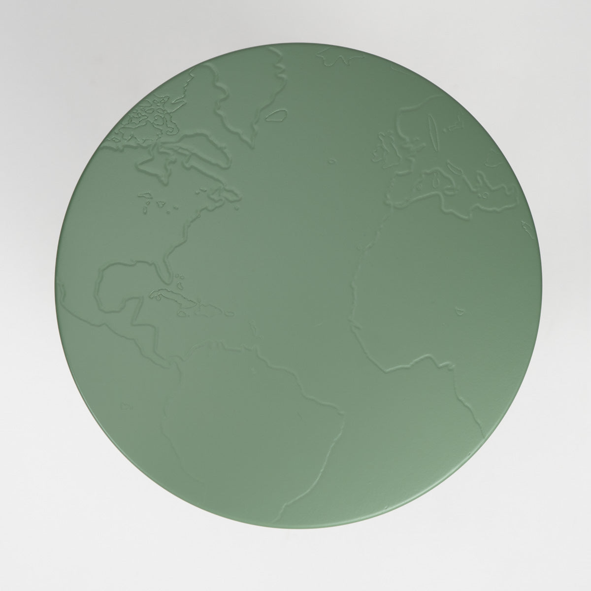 Green circular stool with embossed world map design on a white background