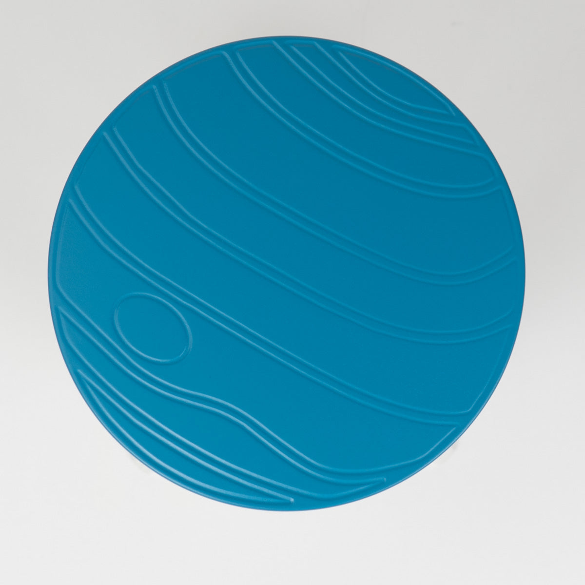 Blue circular object with a pattern resembling Neptune on a gray background