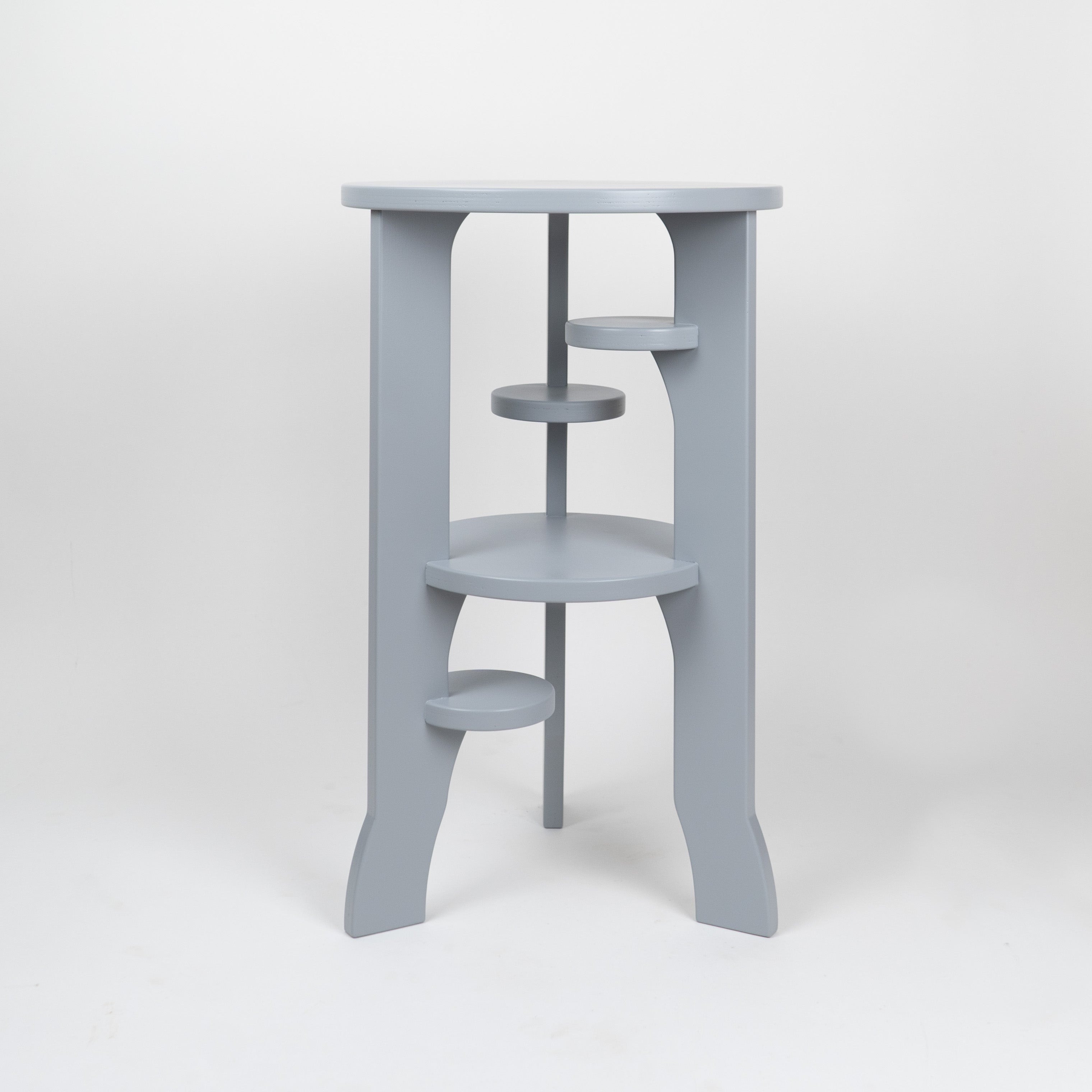 Gray three-tiered shelf on a white background