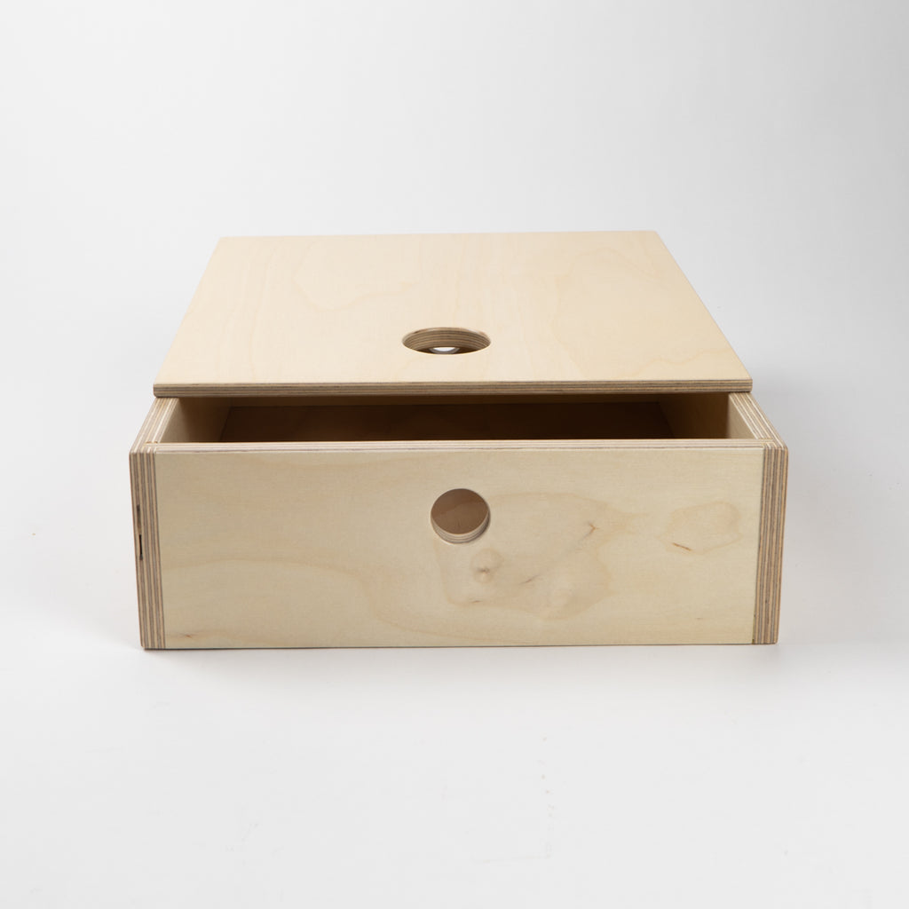 Wooden box with a lid on a white background